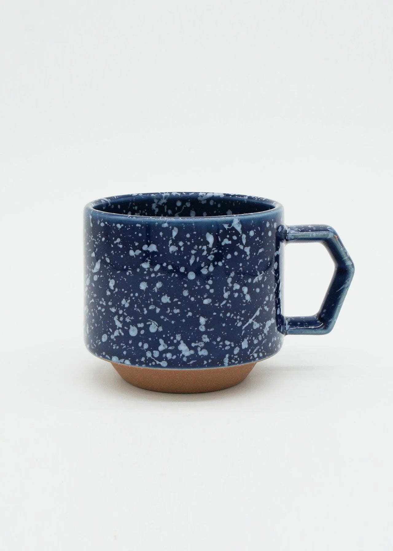 A CHIPS Inc. stackable blue speckled Stacking Mug - Speckled Navy coffee cup.
