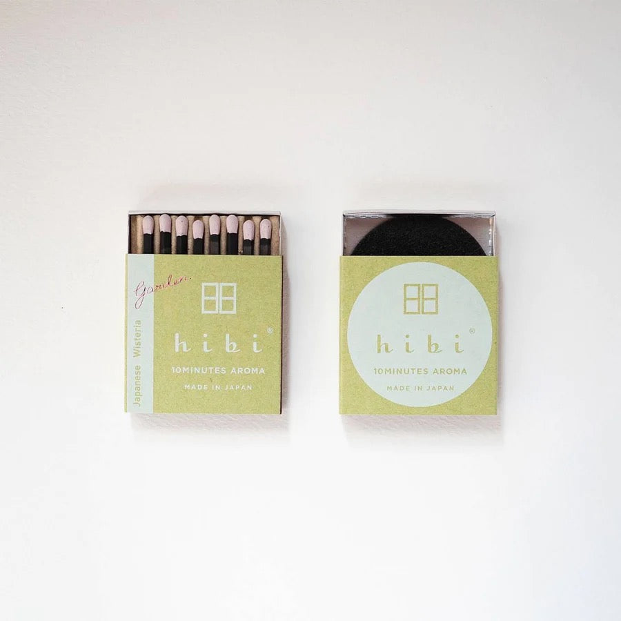 Two hibi Match Box Incense Garden – Japanese Wisteria on a white surface.
