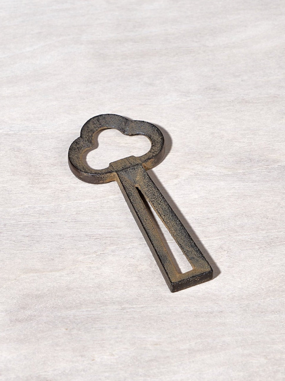 A Clover Bottle Opener – Rusty Brown with a Chushin Kobo shape on it.