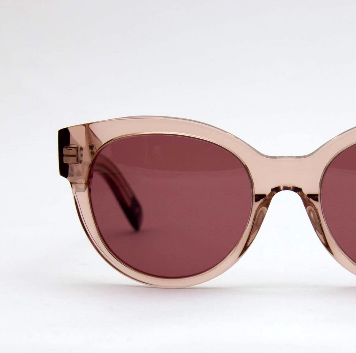 A pair of Paris Sunglasses - Pale Rose by Dick Moby on a white background.