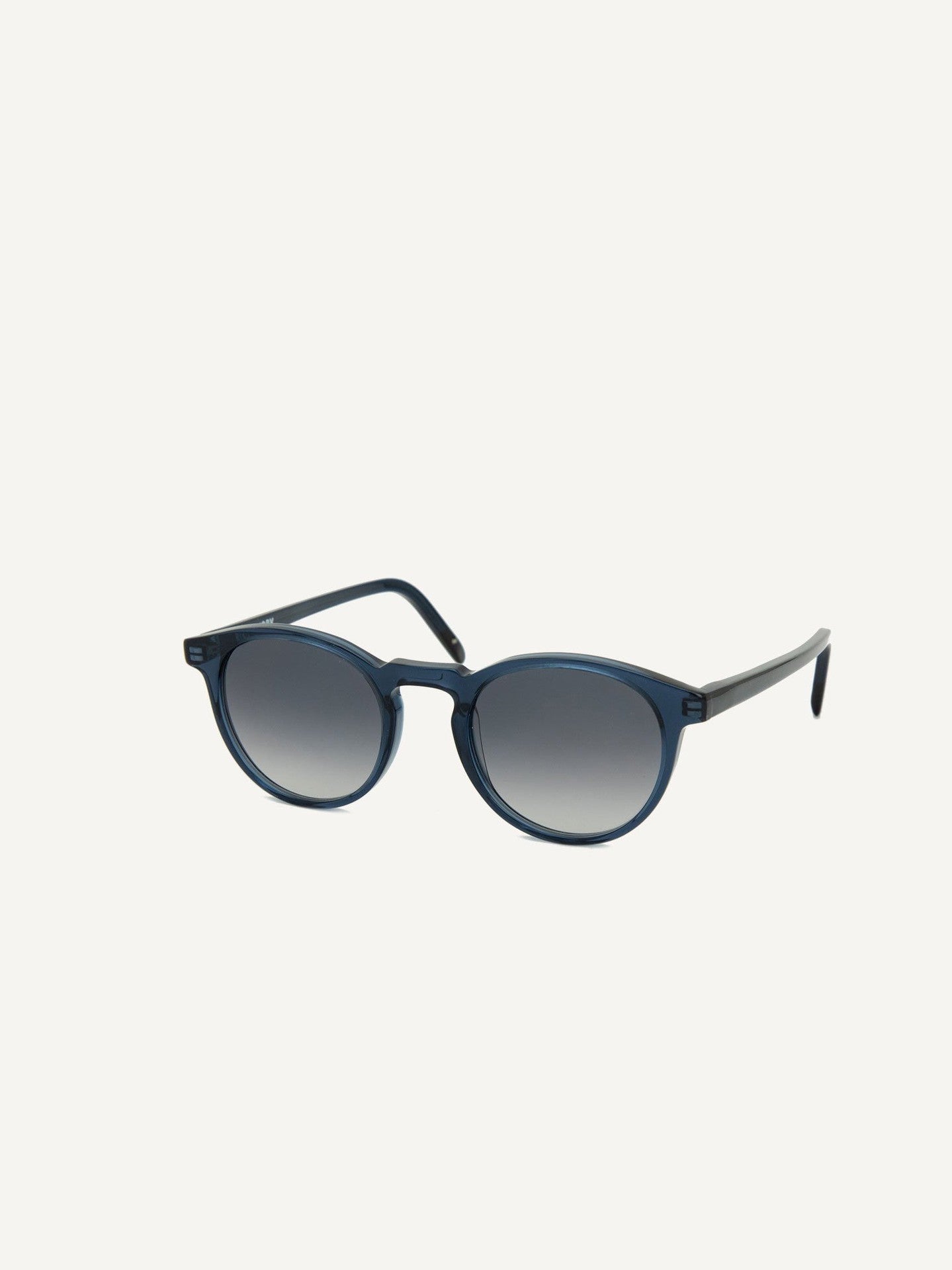 A pair of Seattle Sunglasses – Blue Lagoon by Dick Moby on a white background.