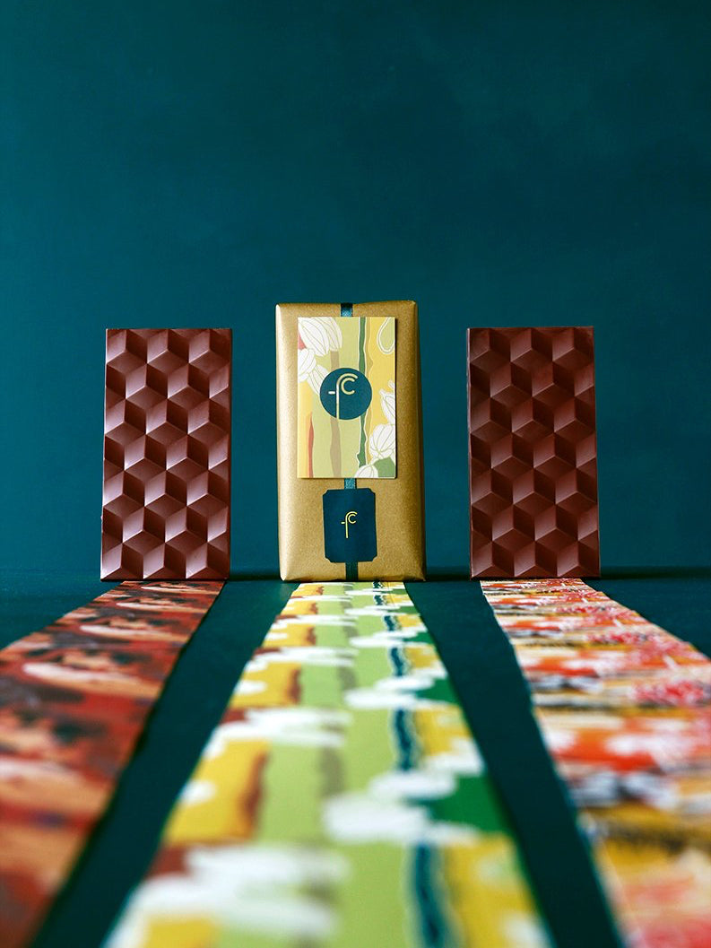 A row of Foundry Chocolate's Three Origin Gift Pack – Gold Winners on a table.