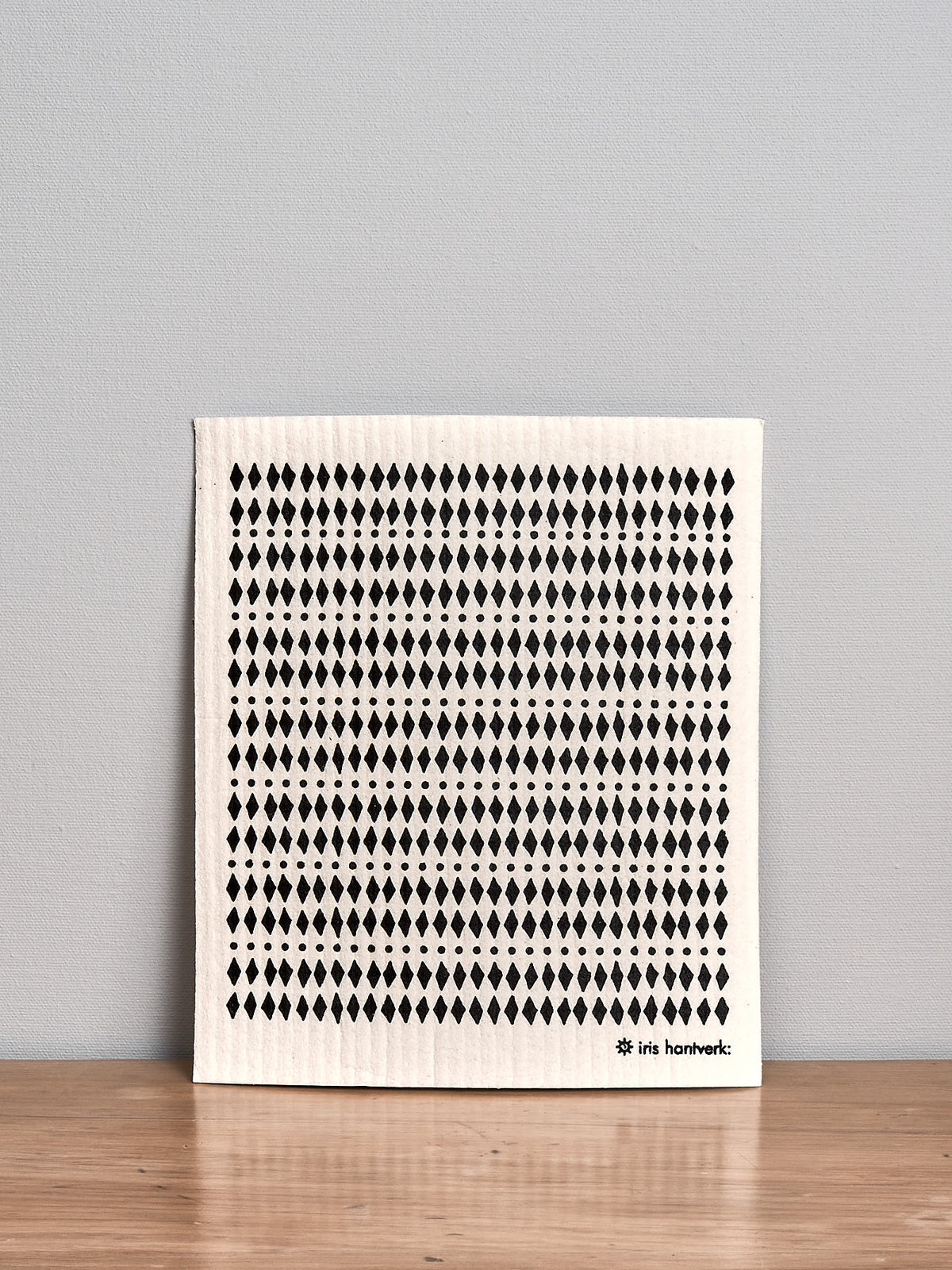 A black and white Household Cloth – Mini Diamond with dots on it, by Iris Hantverk.