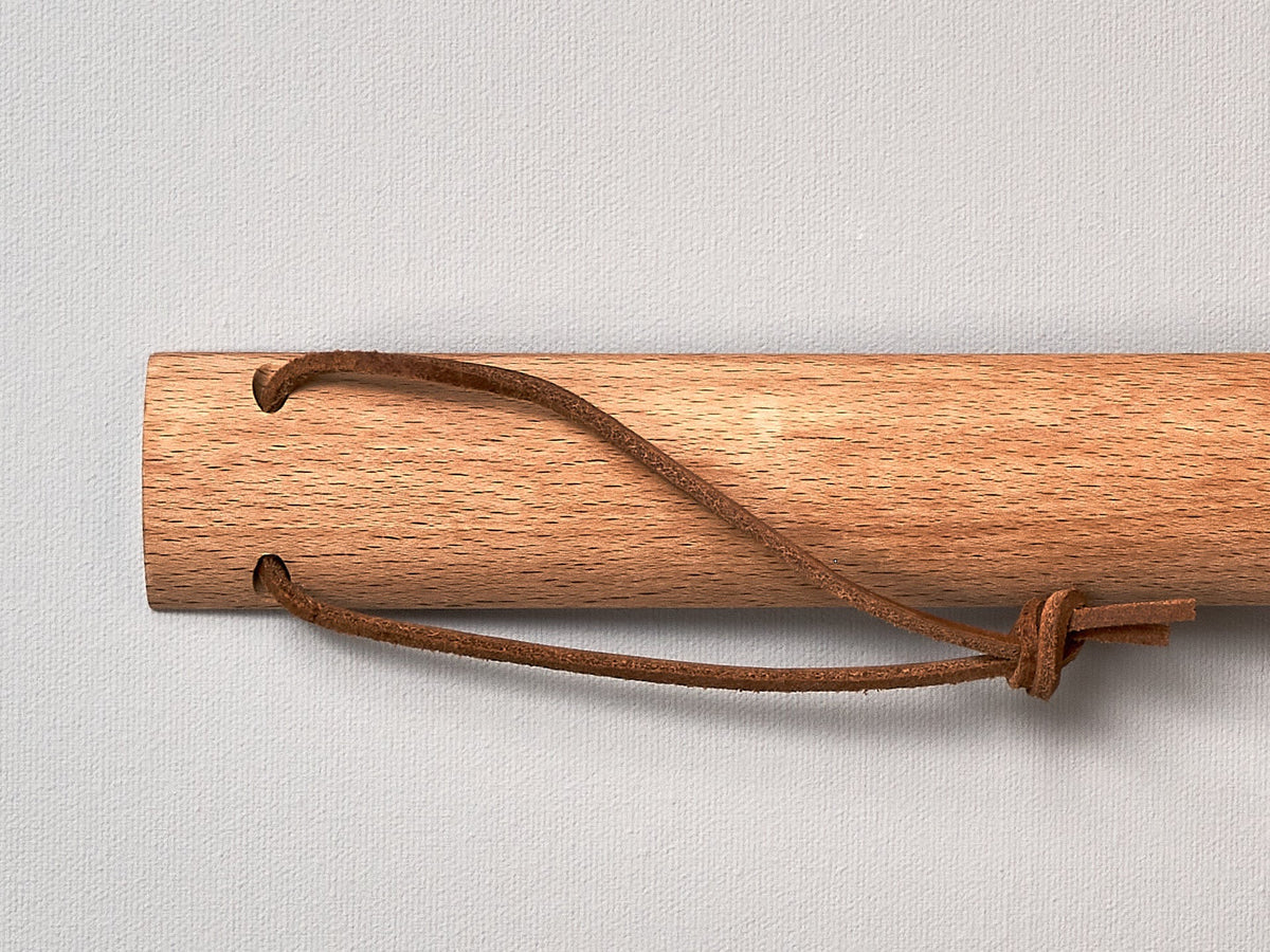 An Iris Hantverk shoe horn with a rope attached to it.