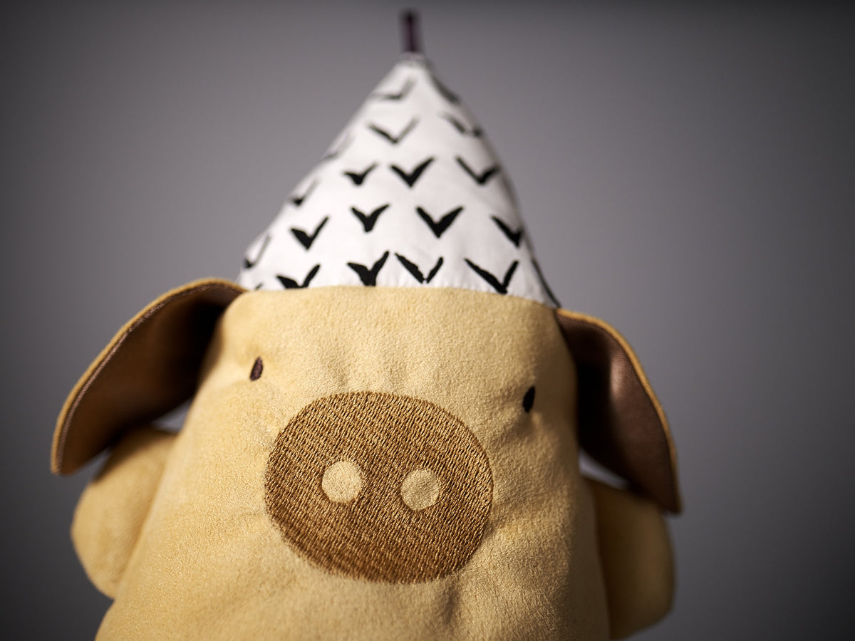 A Yali le Cochon by Raplapla wearing a party hat.