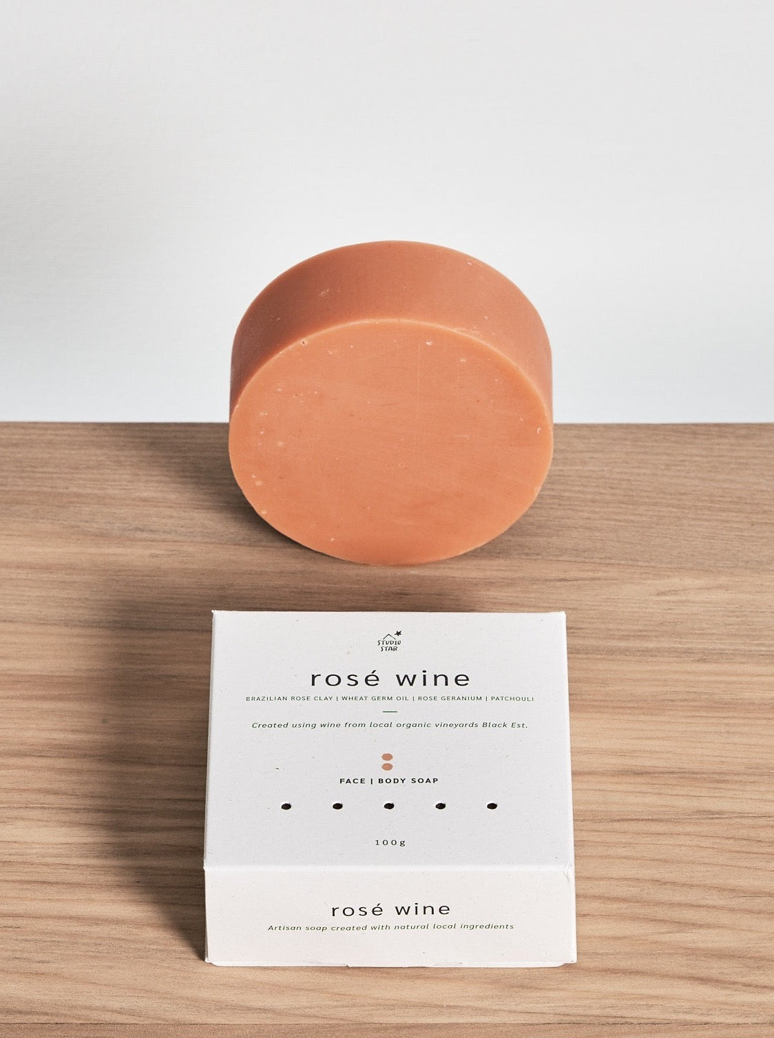 Studio Star&#39;s Rosé Wine Soap on a wooden table.