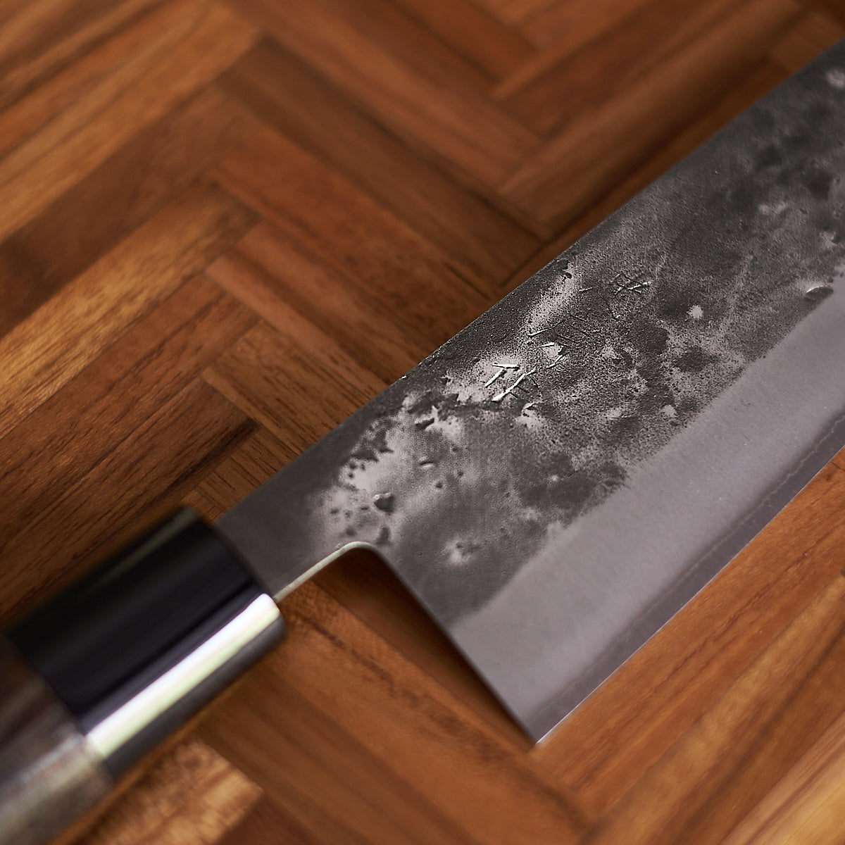 The Tadafusa Bocho Santoku Knife, known for its all-purpose capabilities and vegetable focus, offers the traditional Japanese style.