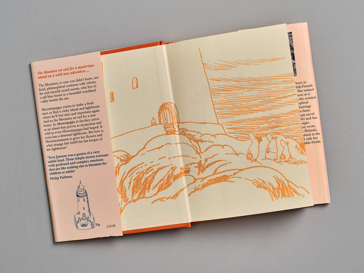 An open book with a drawing of Moominpappa at Sea by Tove Jansson.