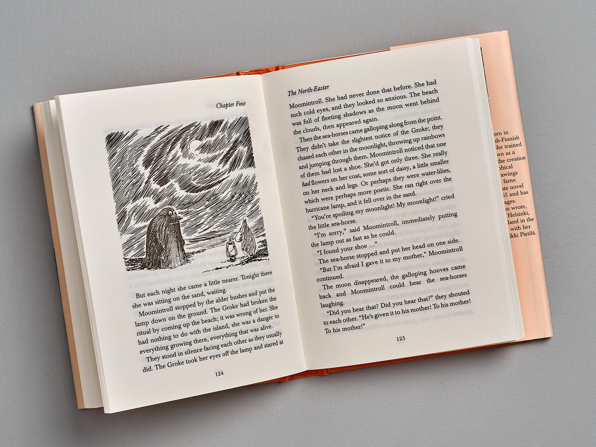 An open book with an image of &quot;Moominpappa at Sea&quot; by Tove Jansson.