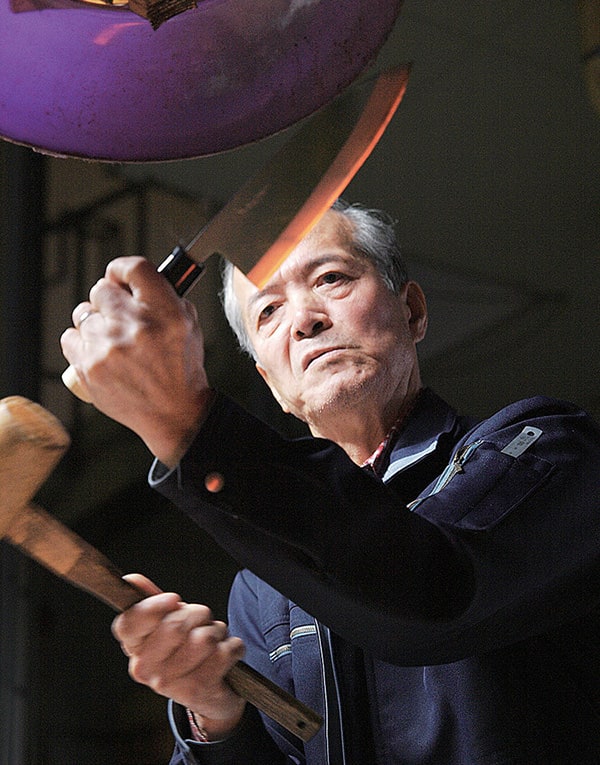A man holding a knife.
