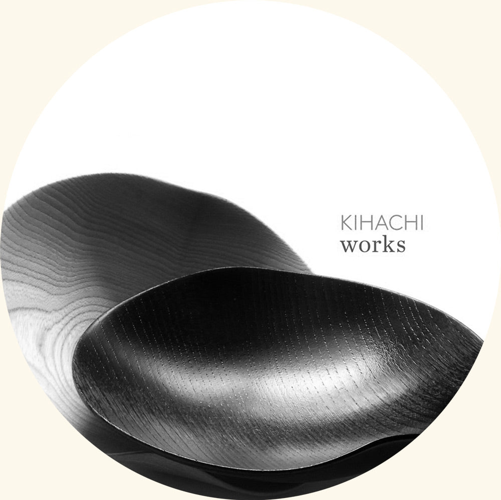 Two black, curved wooden bowls overlapping on a white background with the text "KIHACHI works" displayed on the right.