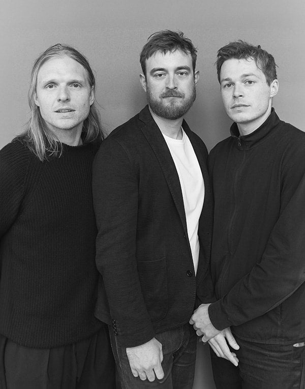 A group of men posing for a picture.