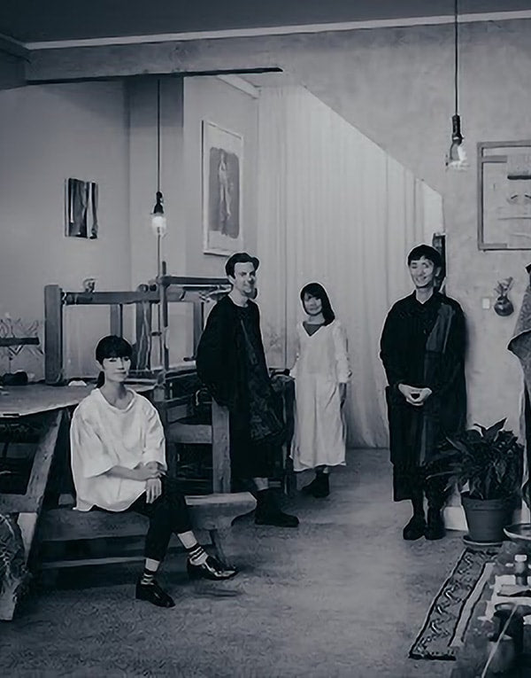 A black and white photo of a group of people in a room.