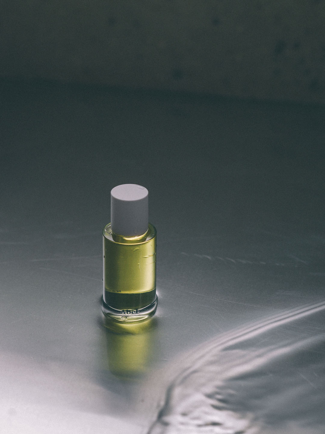 A small bottle of Abel&#39;s Cyan Nori – a sweet, salty musk eau de parfum sitting on top of a metal surface.