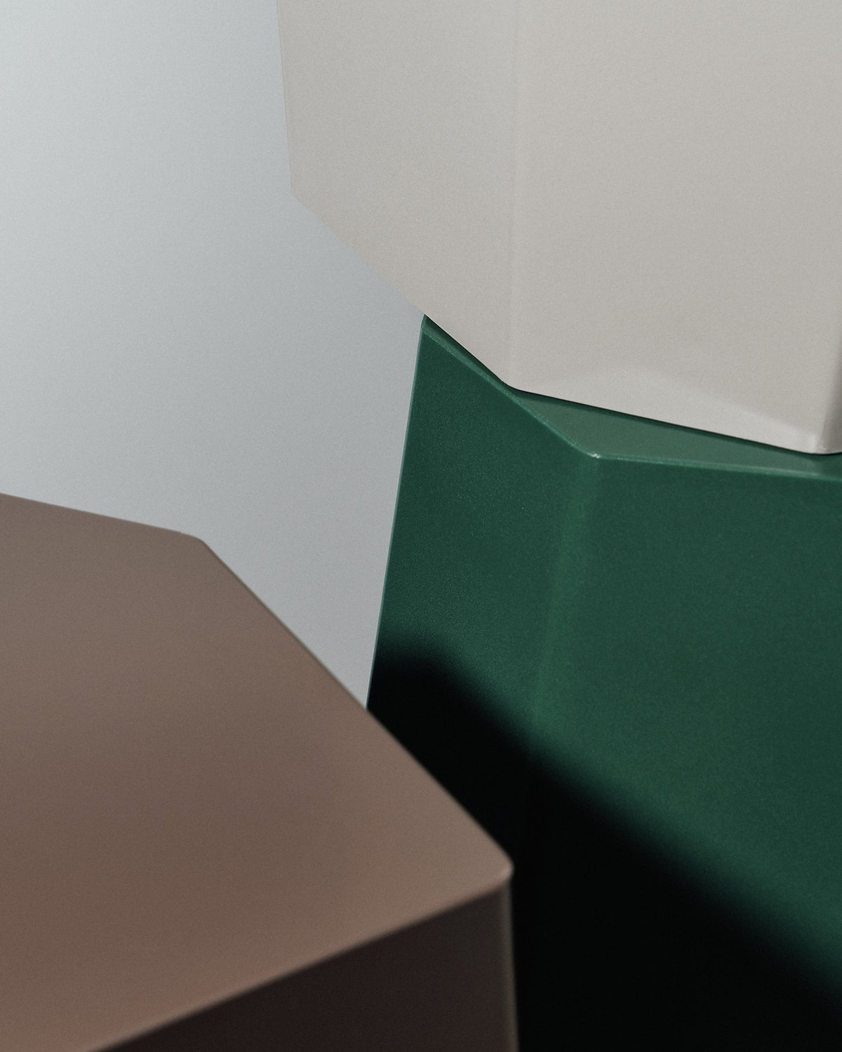 A green, brown, and beige set of Martino Gamper Arnold Circus Stool – Cloud side tables.