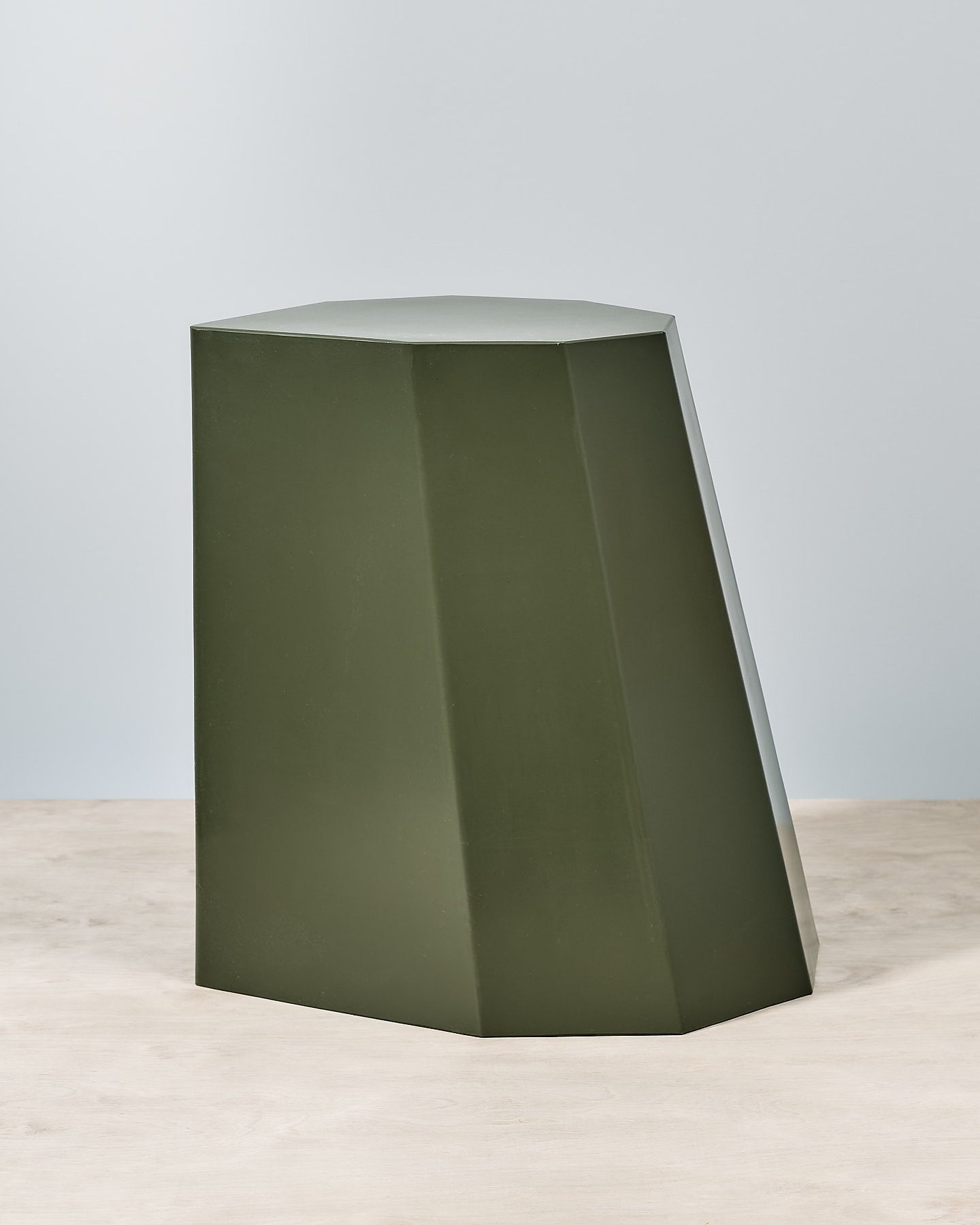 An Arnold Circus Stool - Khaki by Martino Gamper on a white surface.