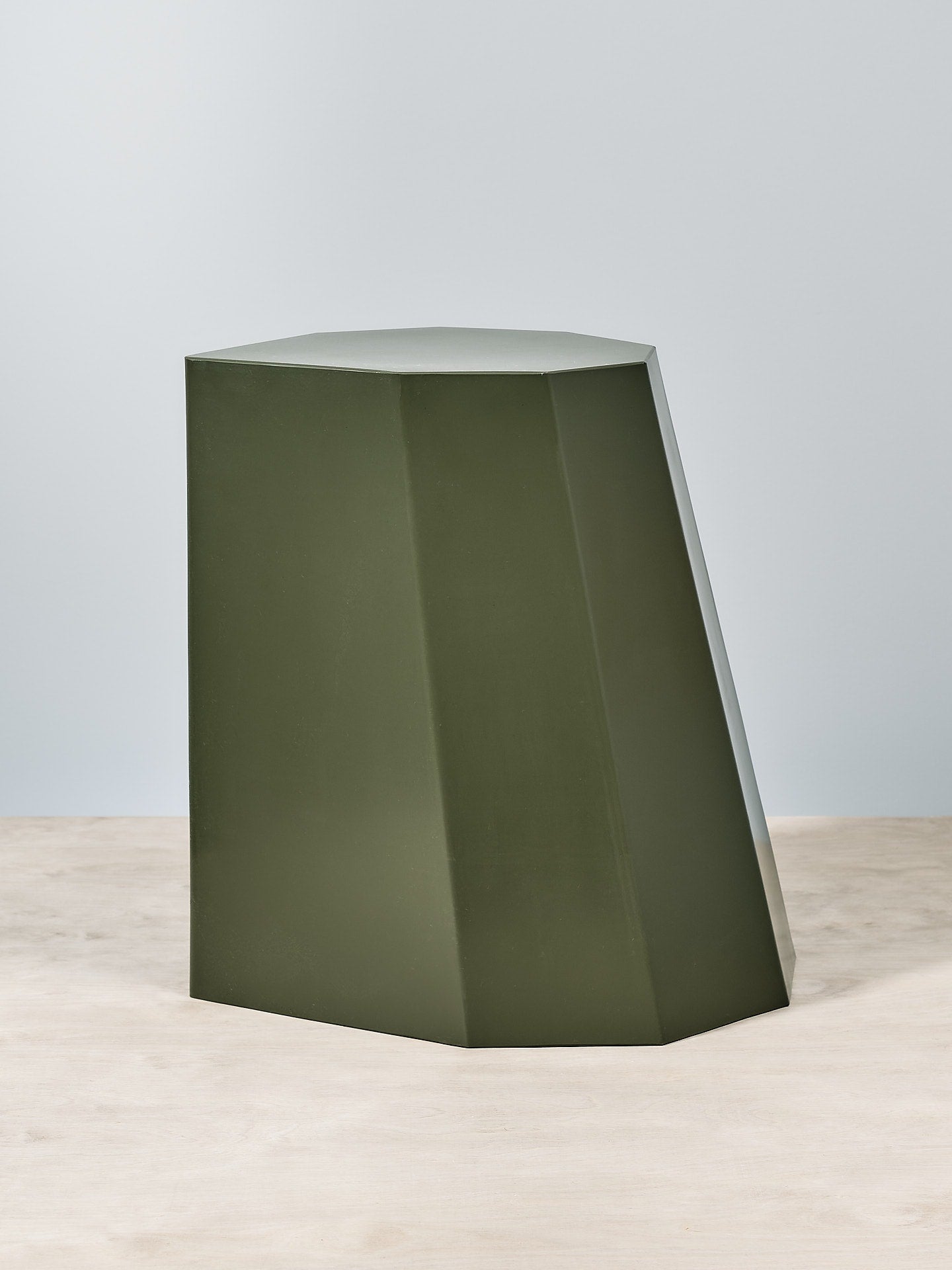An Arnold Circus Stool - Khaki by Martino Gamper on a white surface.