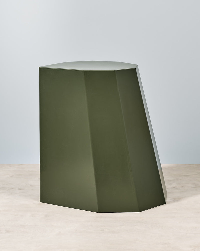 An Arnold Circus Stool - Khaki by Martino Gamper on a white surface.