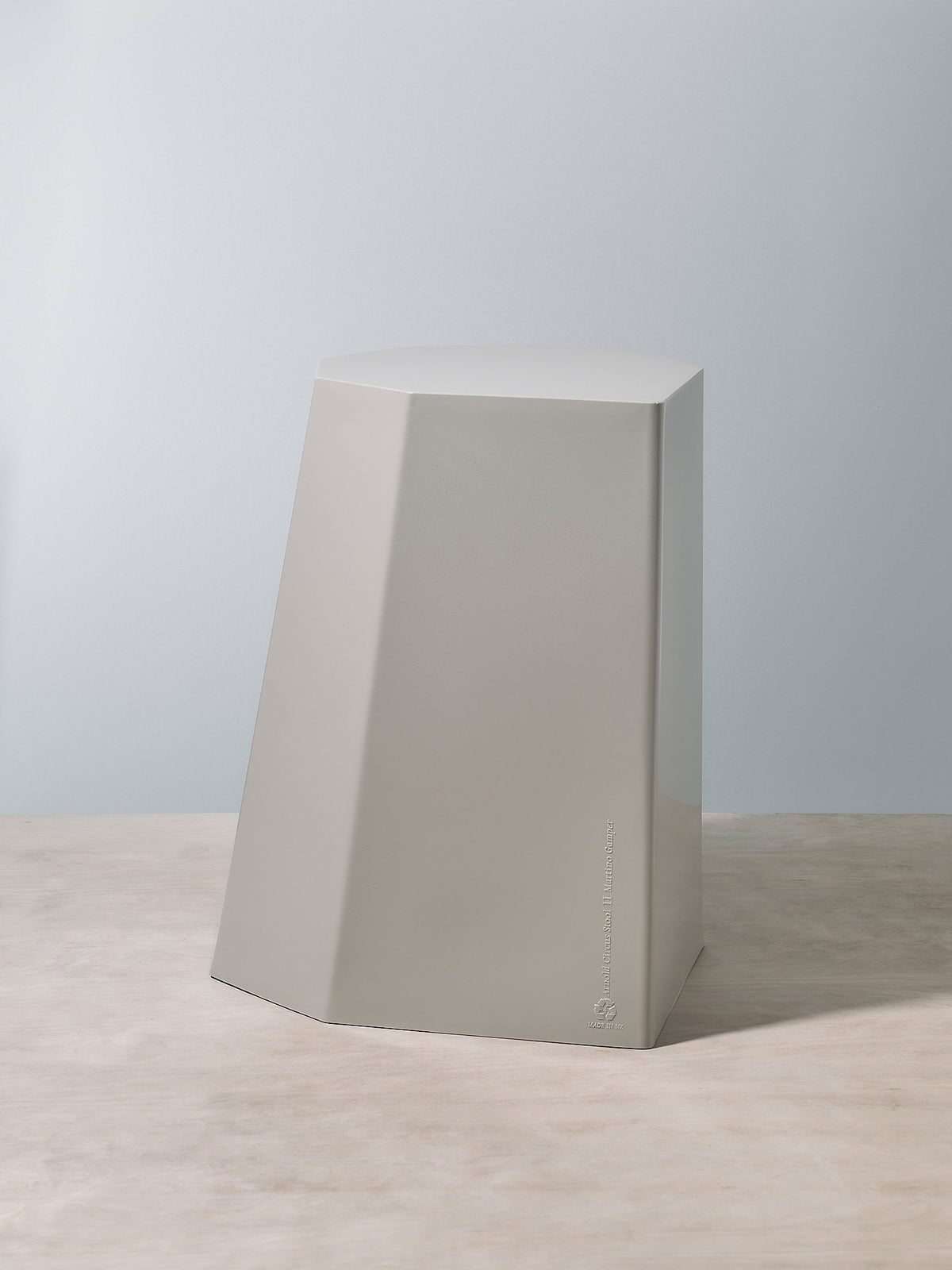 An Arnold Circus Stool – Cloud by Martino Gamper sitting on top of a table.