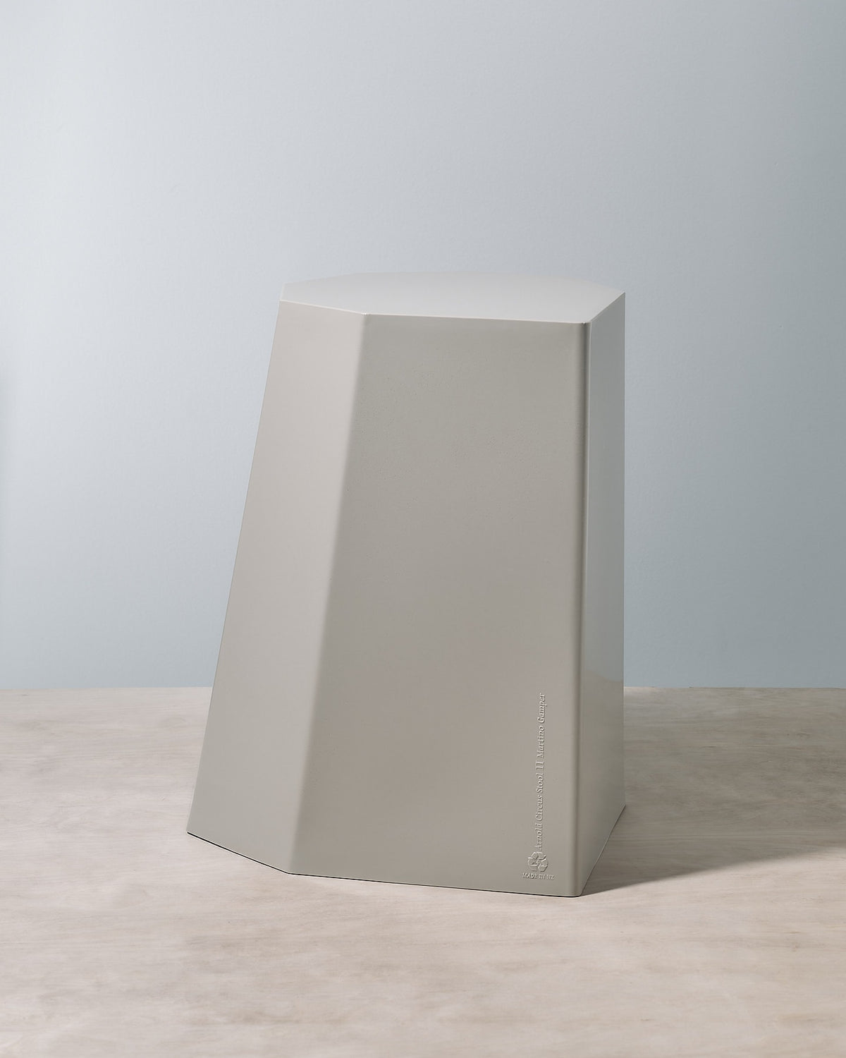 An Arnold Circus Stool – Cloud by Martino Gamper sitting on top of a table.