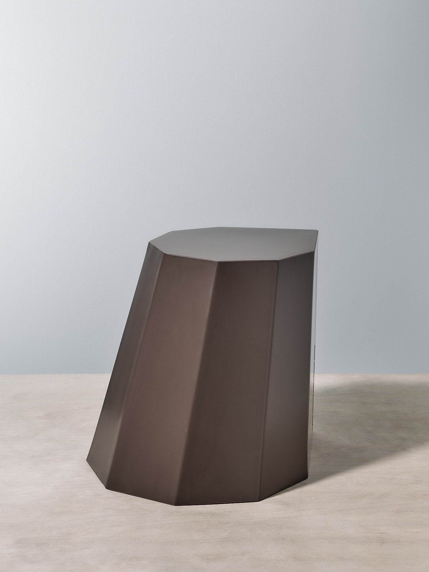 A Martino Gamper Arnoldino Stool – Cocoa with a geometric shape.