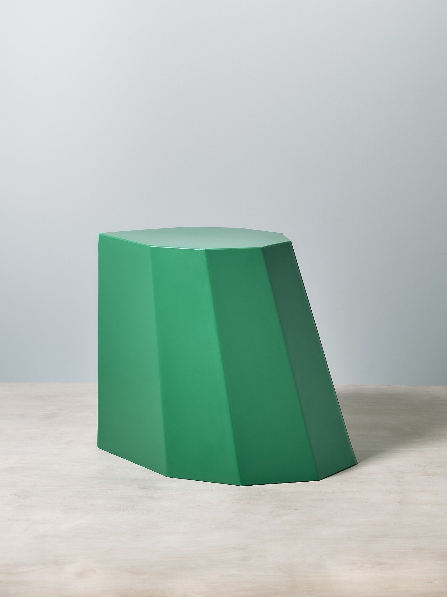A Arnoldino Stool by Martino Gamper on a white table.