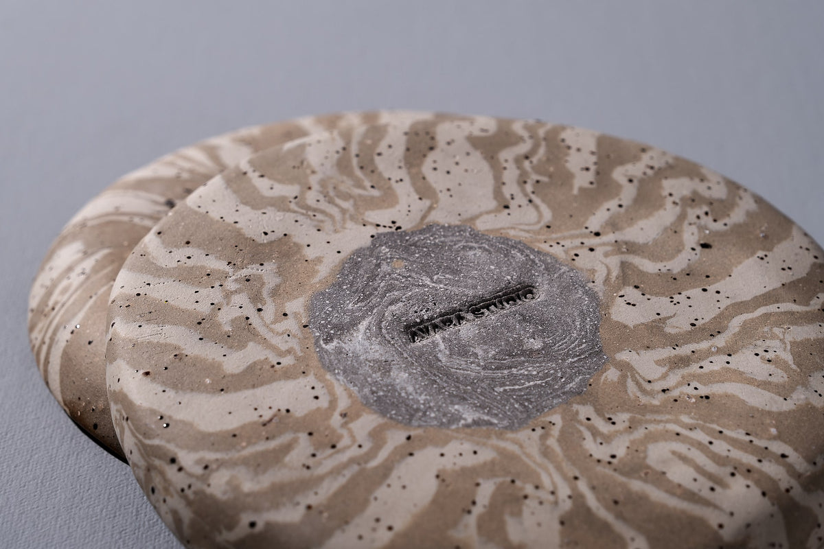 A Trinket Dish - Swirl from Avara Studio with a design on it.