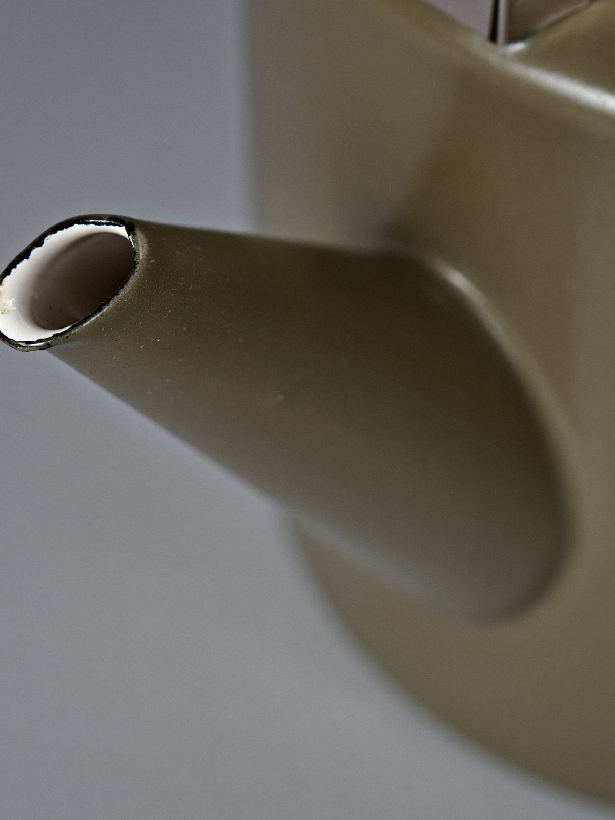 Close-up of the spout on the Enamel Two-Tone Kettle in Olive Drab, featuring a matte finish and vintage-inspired design, set against a plain background.