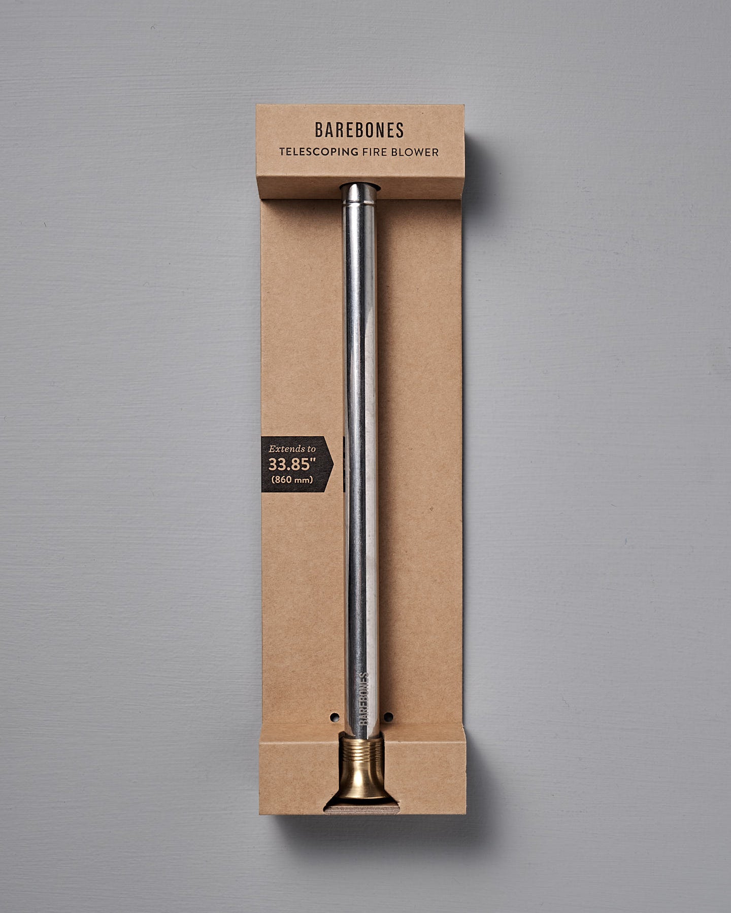 The Barebones Telescoping Fire Blower features a metal tube with brass tip, extends up to 33.85 inches, and is ideal for safely stoking campfires or fireplaces. Comes packaged and ready for outdoor use.