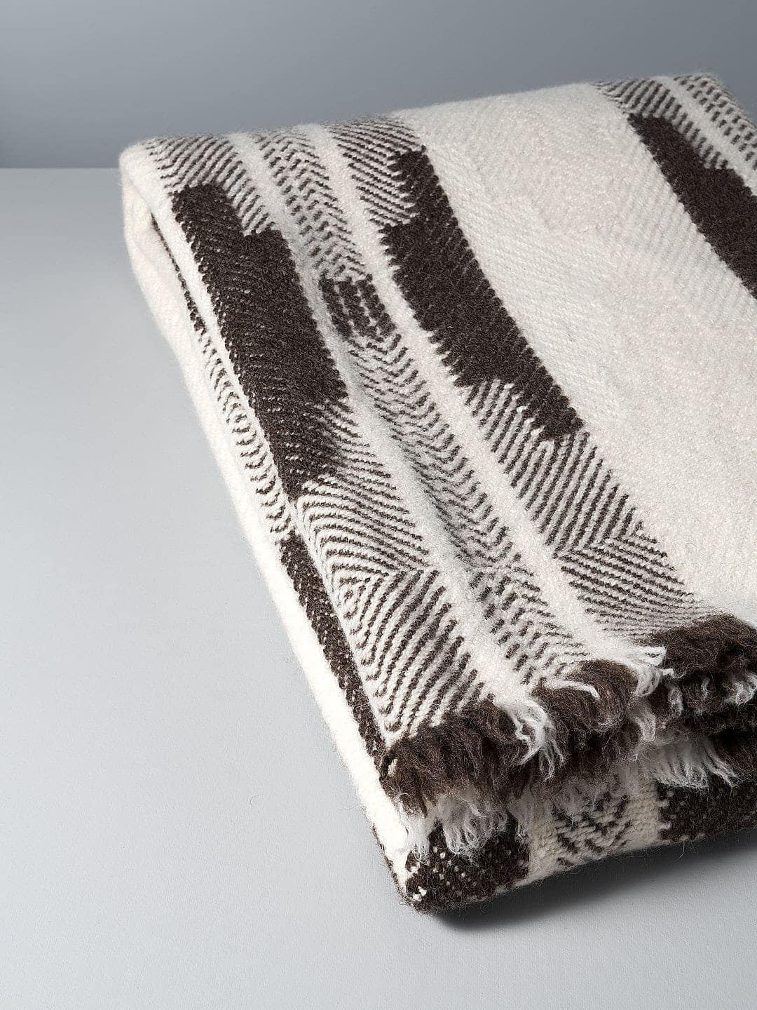 A Rodopska Takan Bulgarian Wool Blanket on a white surface.