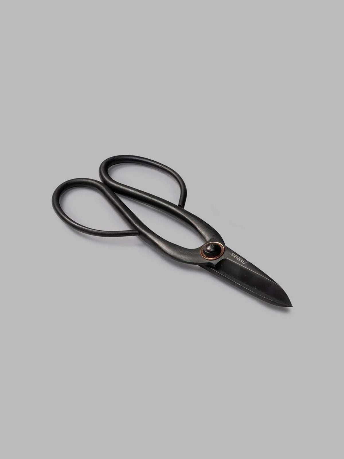 A pair of Barebones Artisan Pruning Shears, featuring gracefully curved handles that are ideal for all your gardening tasks, is elegantly displayed on a gray background.