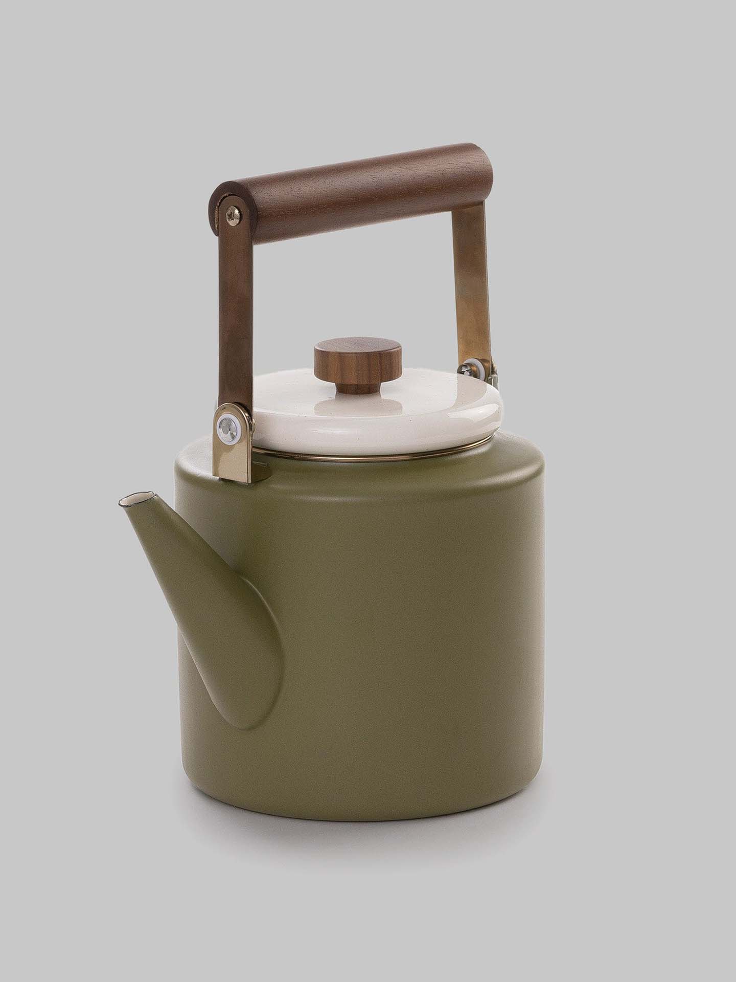 The Barebones Enamel Two-Tone Kettle in Olive Drab, featuring a vintage-inspired design with a walnut handle and white lid, is set against a plain gray background.