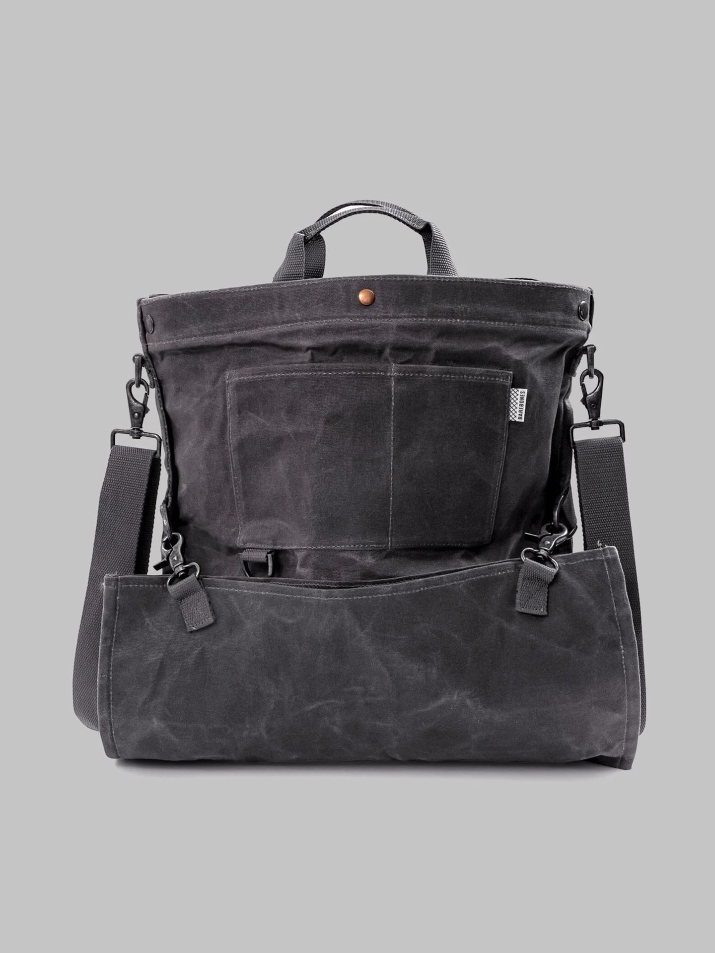 The Gathering Bag – Grey by Barebones is a vintage orchard design backpack made from black fabric with a front pocket and adjustable shoulder straps, perfect as a trusted foraging and gardening partner.