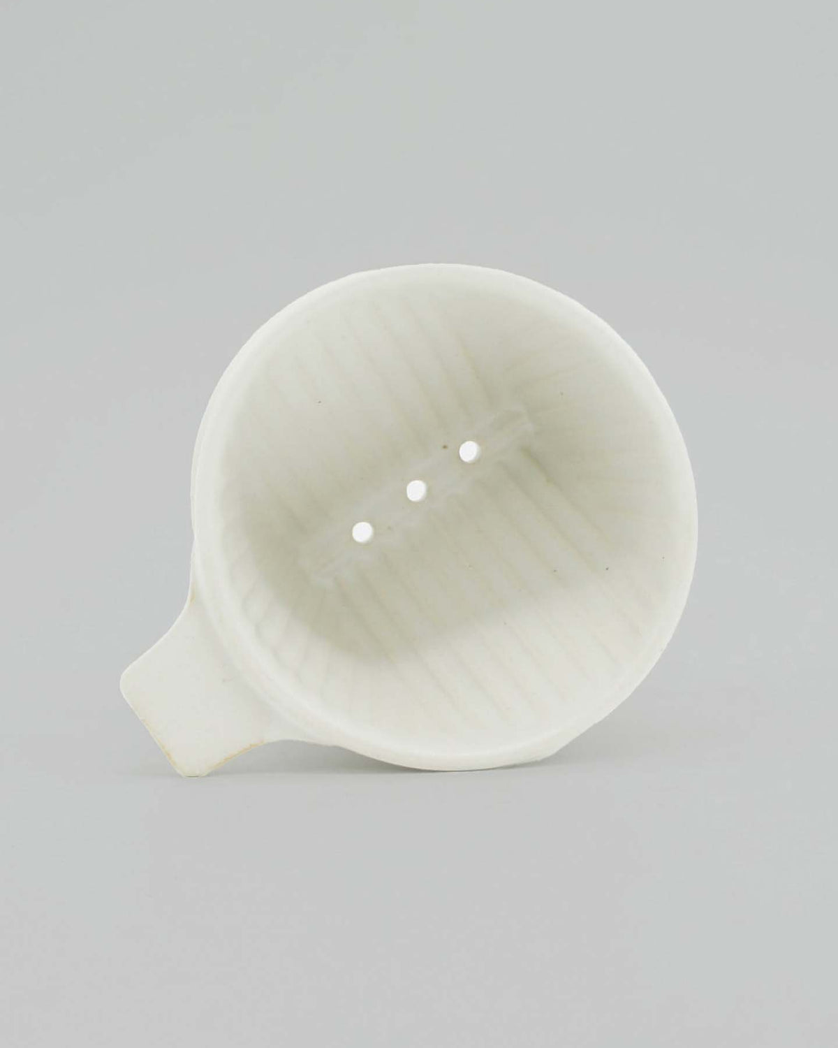 Seen from above, the CHIPS Inc. Mino-yaki Coffee Dripper (2 Cup) in white showcases three drainage holes, skillfully blending elegance with functionality.