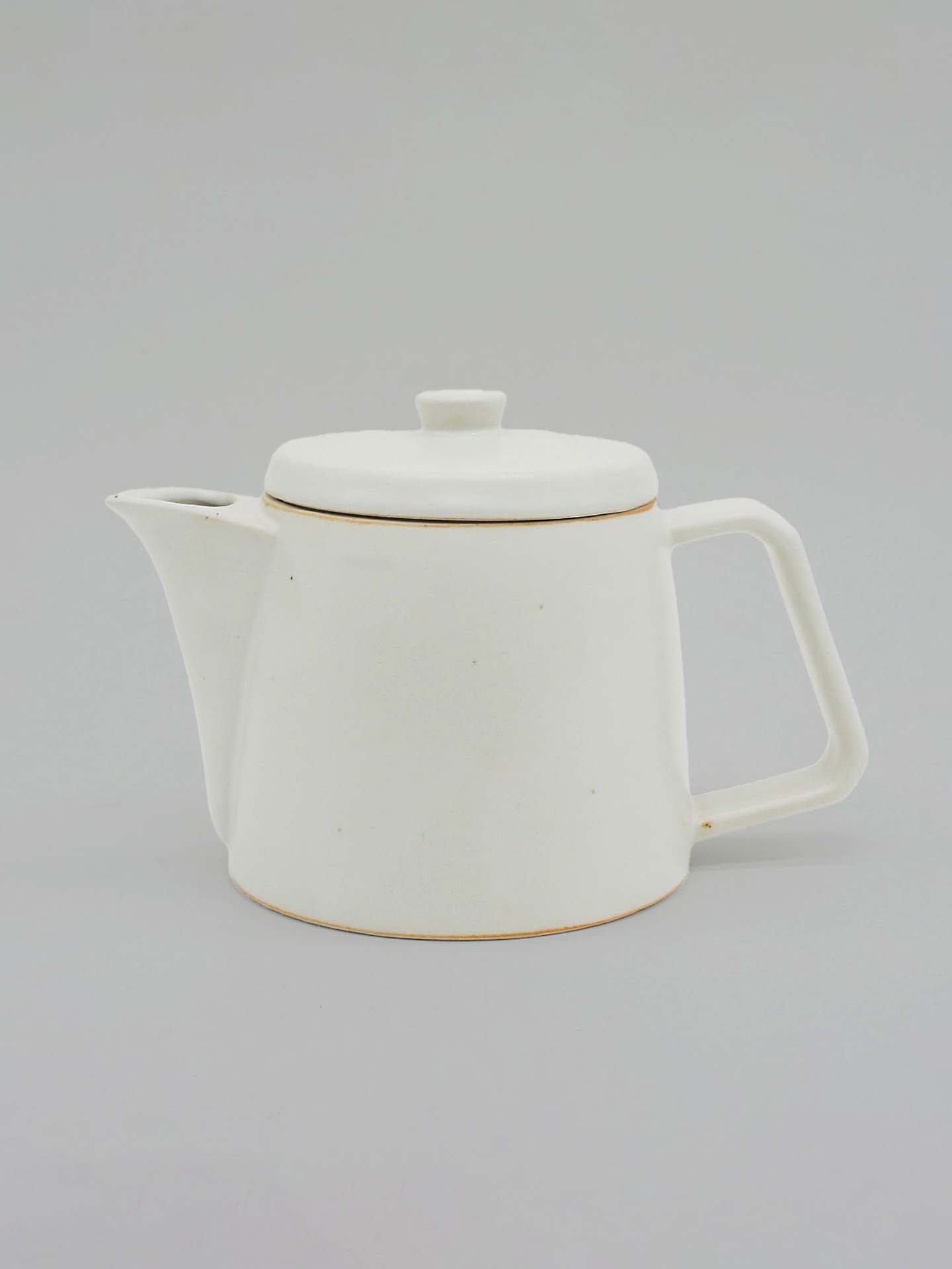 The Mino-yaki Teapot (2 Cup) – White, crafted by CHIPS Inc., showcases a spout, handle, and lid in a sleek white ceramic design. This teapot is perfect for steeping loose leaf tea, combining tradition and elegance in every pour through the ancient Mino-yaki pottery technique.