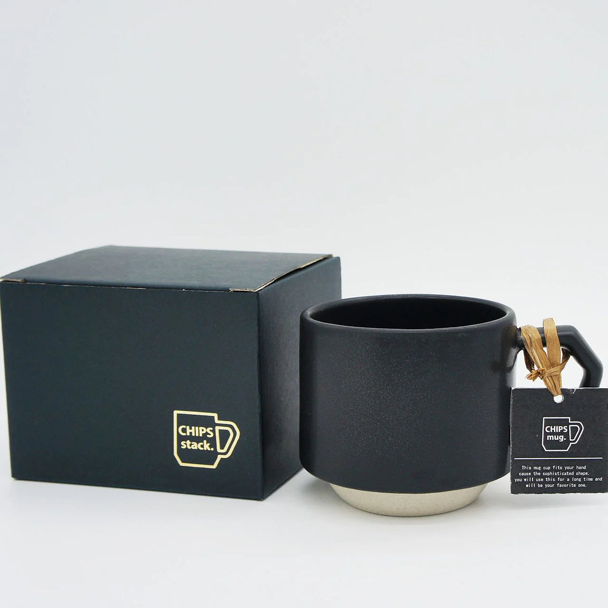 A CHIPS Inc. stackable black coffee mug with a tag and box: the Stacking Mug – Black.