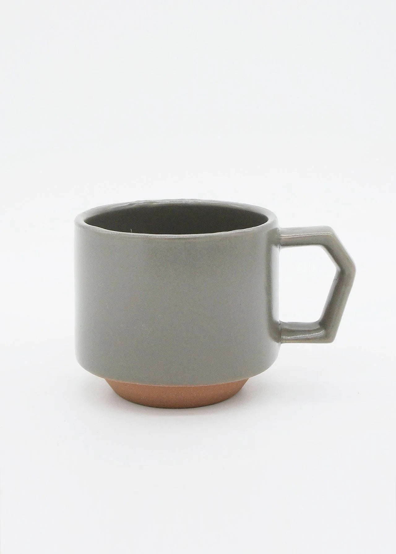 A stacking mug - Grey with a handle on a white background.