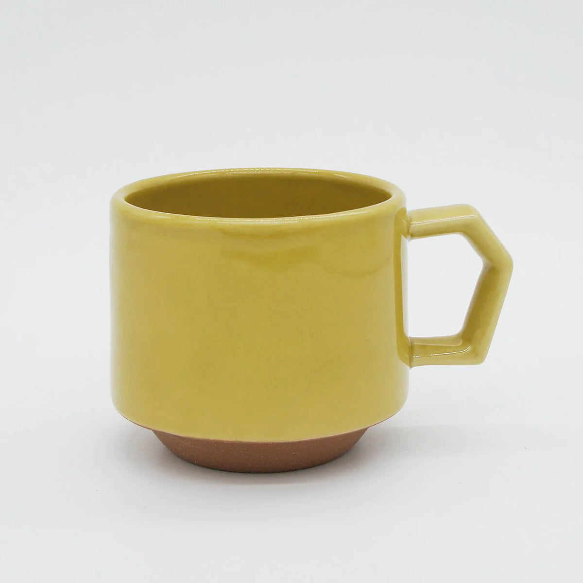 A yellow Stacking Mug – Mustard with a handle on a white background made by CHIPS Inc.