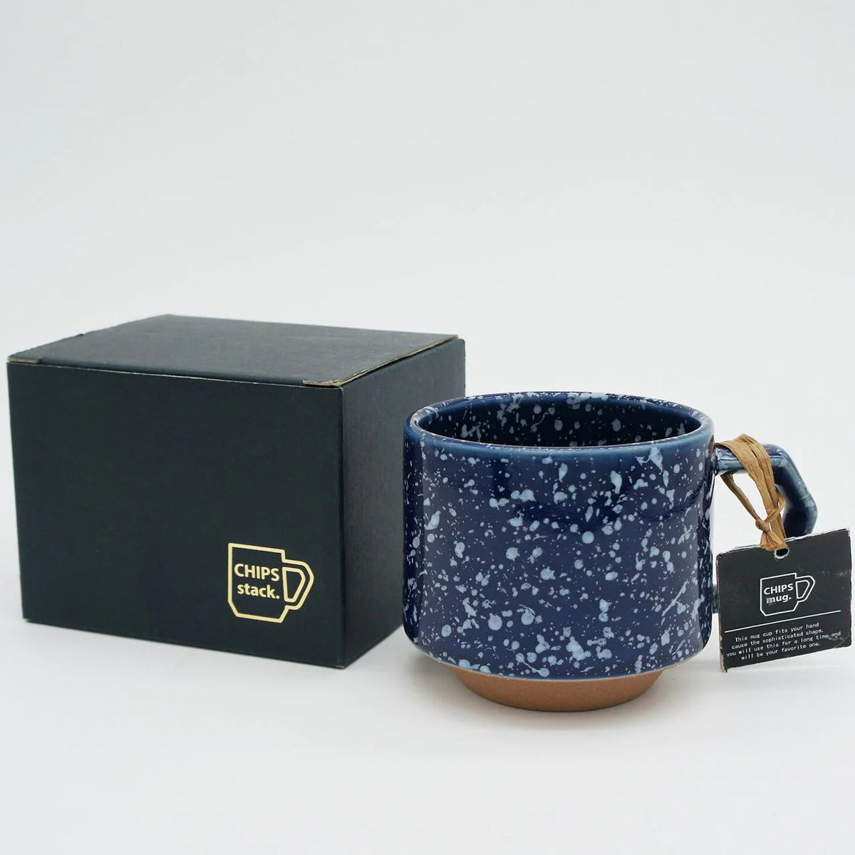 A seamlessly stackable porcelain (Minoyaki) Stacking Mug - Speckled Navy by CHIPS Inc. with a black box.