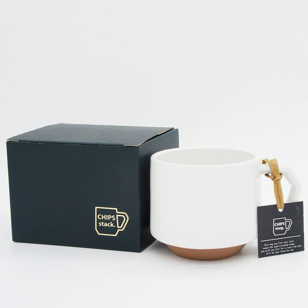 A CHIPS Inc. Stacking Mug – White next to a black box, showcasing its functionality.