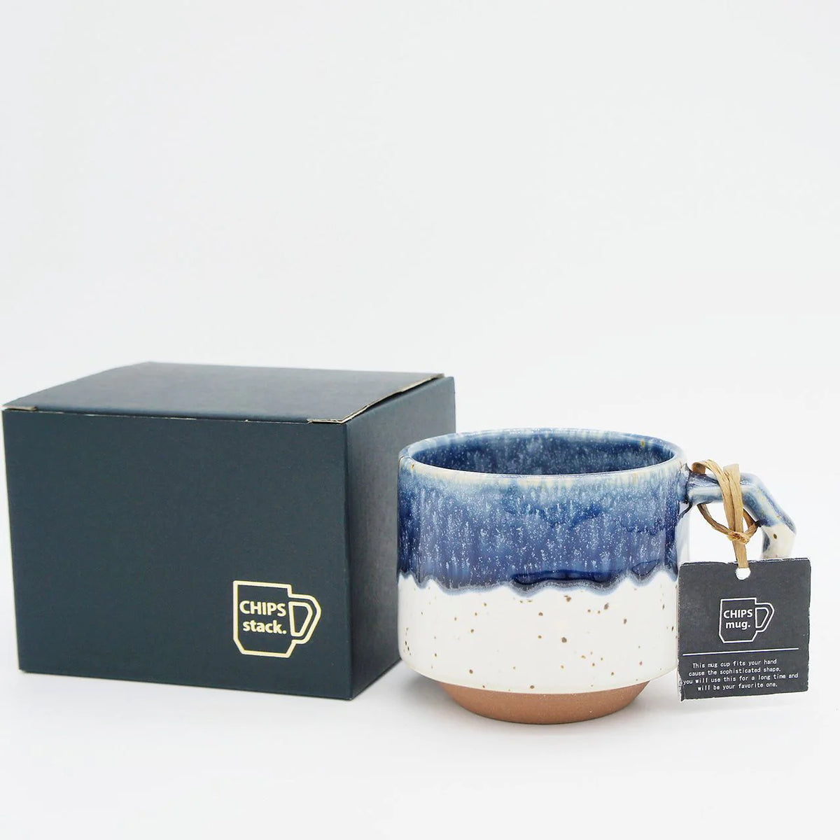 A Stacking Mug - Navy/White with aesthetic appeal, presented in a box with a tag, manufactured by CHIPS Inc.