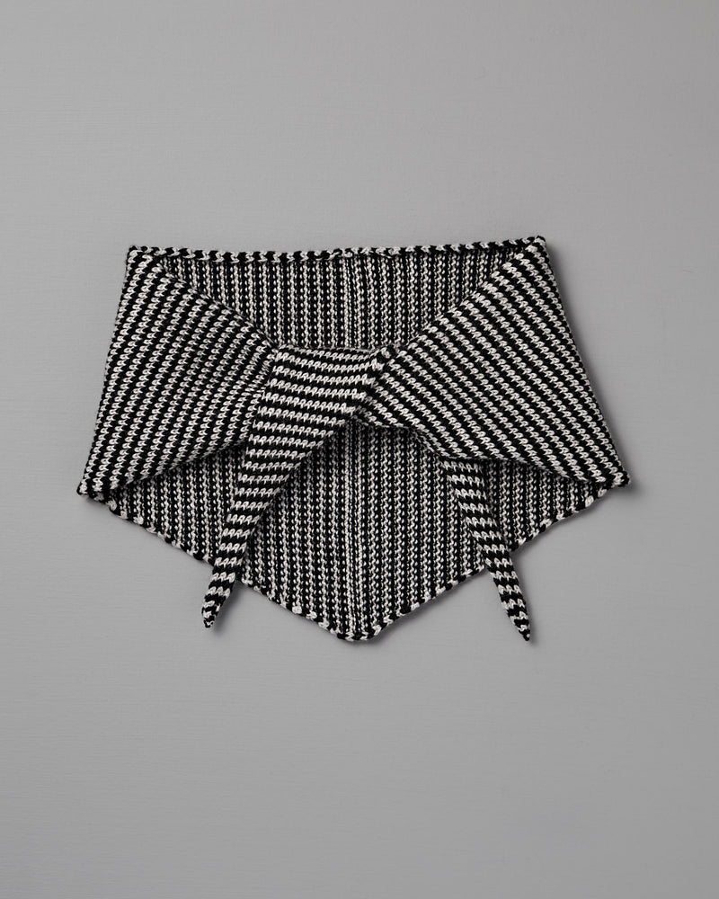 The Daisy Scarf – Black & Creme Stripe features a geometric knit pattern in black and creme, shown flat on a gray background with pointed ends overlapping. Dimensions: 97cm long x 22cm wide.