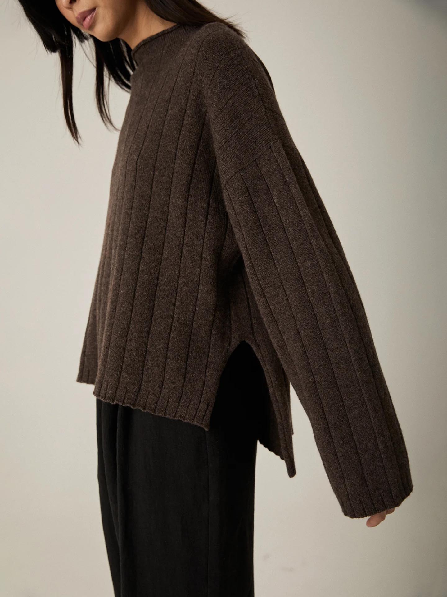 A woman wearing an oversized Francie Echo Knit – Truffle sweater.