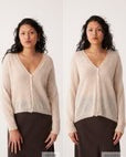 Petite woman with long curly hair wearing the Mist Cardigan in Creme and a dark brown skirt, standing against a plain white background in two similar poses.