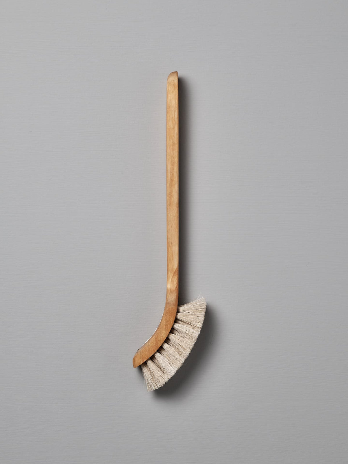 A wooden-handled dish brush with Tampico fibre bristles, made in Sweden, is shown against a plain gray background. The product is called the Dish Brush – Soft by Iris Hantverk.