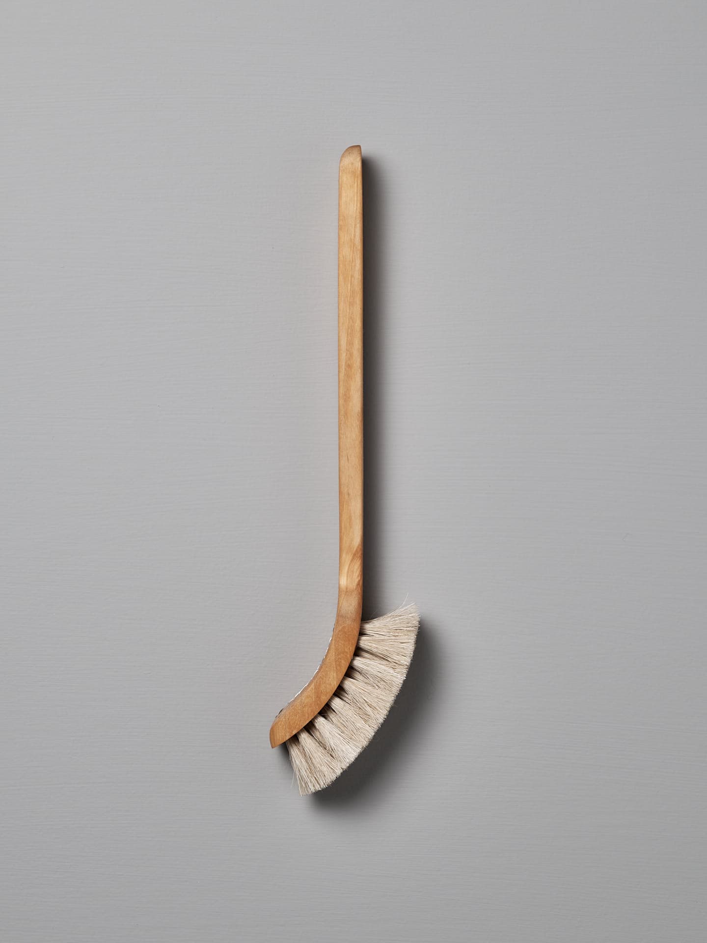 A wooden-handled dish brush with Tampico fibre bristles, made in Sweden, is shown against a plain gray background. The product is called the Dish Brush – Soft by Iris Hantverk.