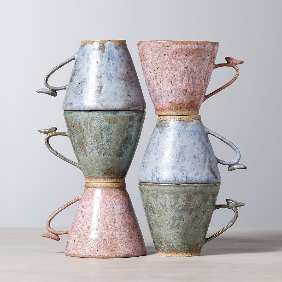 Four Bird Handle Mug – Kōkako mugs by Jino Ceramic Studio stacked on top of each other.