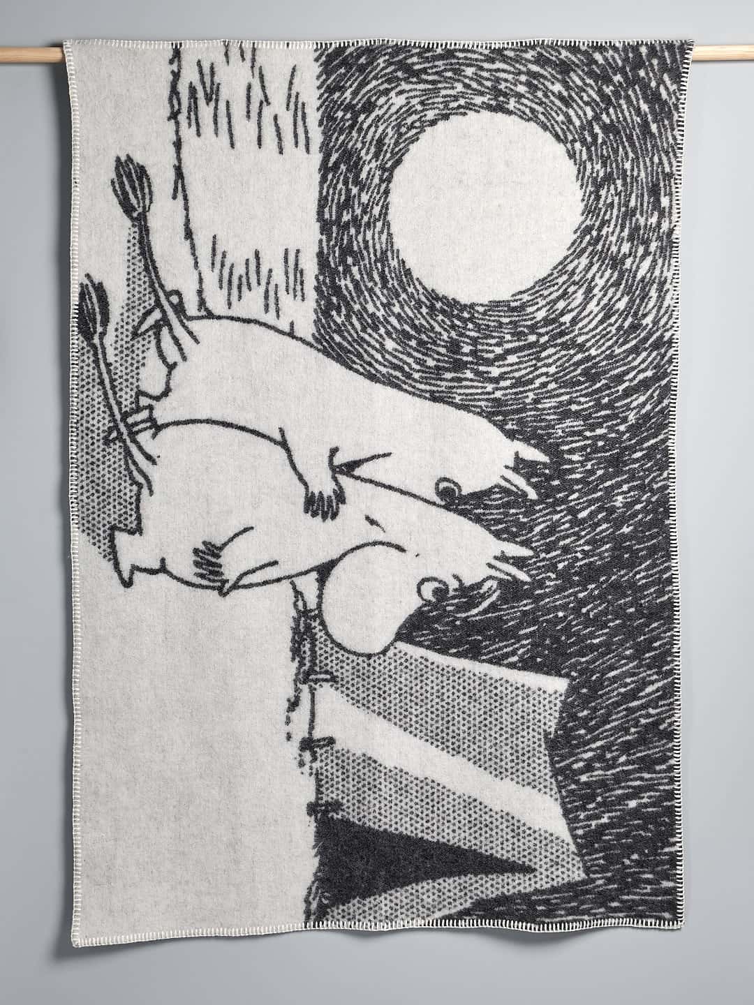 A black and white drawing of a moose on a Klippan Moomin Childs Blanket – Camp Adventure.