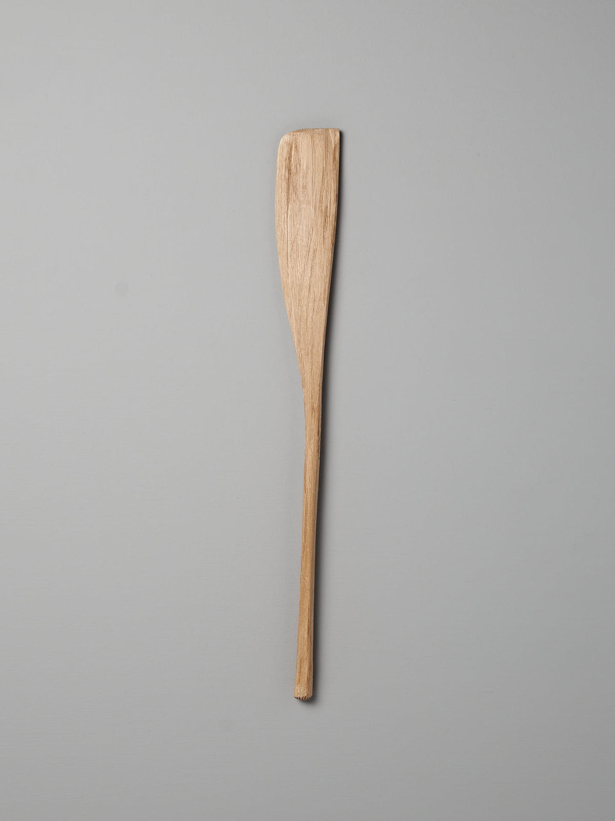 A single Bakers Tool, crafted from Australian She-Oak using traditional techniques by Luke Crouch, is positioned vertically against a gray background.