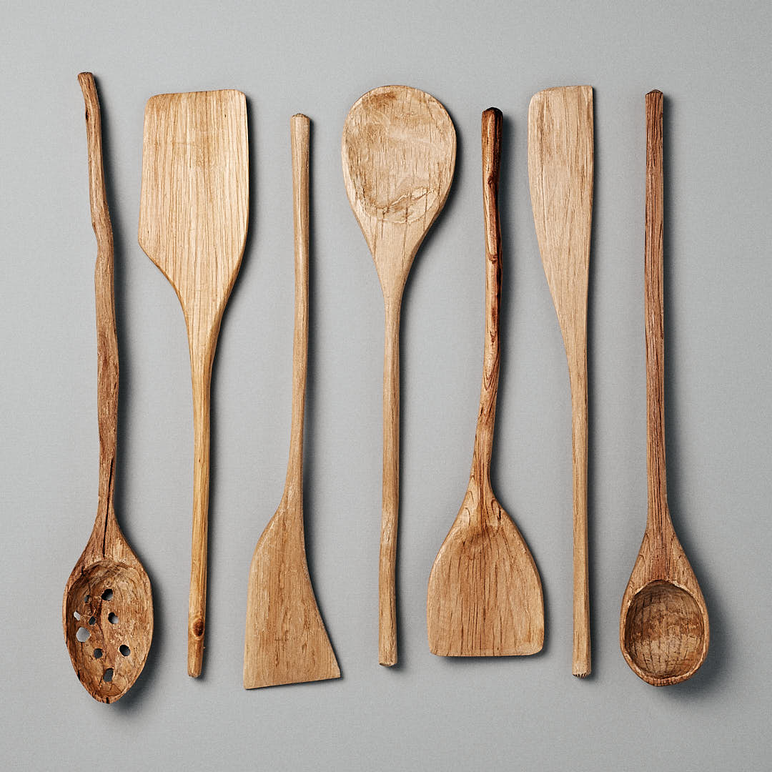 Hand carved wooden spoons on grey table